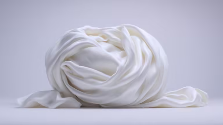 Pristine white Tibetan khata scarf gracefully draped.