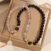 Gold Sheen Obsidian Lotus Charm Bracelet Gold Sheen Obsidian Lotus Charm Bracelet