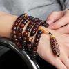 Three-Eyed Dzi Bead & Jade Luck Bracelet Three-Eyed Dzi Bead & Jade Luck Bracelet