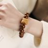 Purple Bodhi Seed Wisdom Bracelet with Dancing Lion Purple Bodhi Seed Wisdom Bracelet with Dancing Lion