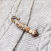 Tibetan Nine-Eye Dzi Bead Bodhi Seed Brooch Tibetan Nine-Eye Dzi Bead Bodhi Seed Brooch
