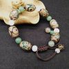 Pulsera Tibetana de Protección con Cuenta Dzi de Tres Ojos Tibetan Three-Eyed Dzi Bead Protection Bracelet