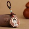 Ebony Wood Avalokitesvara Keychain with Om Mani Padme Hum Ebony Wood Avalokitesvara Keychain with Om Mani Padme Hum
