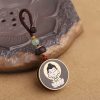 Ebony Wood Avalokitesvara Keychain with Om Mani Padme Hum Ebony Wood Avalokitesvara Keychain with Om Mani Padme Hum