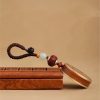 Ebony Wood Avalokitesvara Keychain with Om Mani Padme Hum Ebony Wood Avalokitesvara Keychain with Om Mani Padme Hum