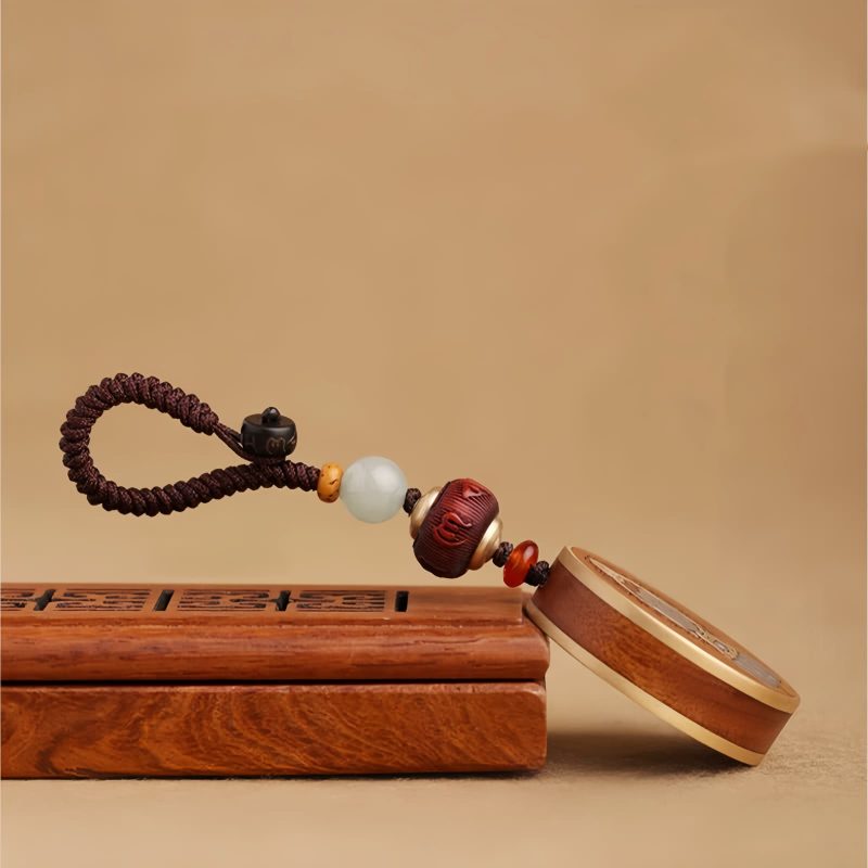 Ebony Wood Avalokitesvara Keychain with Om Mani Padme Hum Ebony Wood Avalokitesvara Keychain with Om Mani Padme Hum