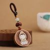 Ebony Wood Avalokitesvara Keychain with Om Mani Padme Hum Ebony Wood Avalokitesvara Keychain with Om Mani Padme Hum
