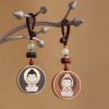 Ebony Wood Avalokitesvara Keychain with Om Mani Padme Hum Ebony Wood Avalokitesvara Keychain with Om Mani Padme Hum