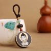 Ebony Wood Avalokitesvara Keychain with Om Mani Padme Hum Ebony Wood Avalokitesvara Keychain with Om Mani Padme Hum