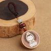 Ebony Wood Avalokitesvara Keychain with Om Mani Padme Hum Ebony Wood Avalokitesvara Keychain with Om Mani Padme Hum