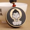 Ebony Wood Avalokitesvara Keychain with Om Mani Padme Hum Ebony Wood Avalokitesvara Keychain with Om Mani Padme Hum