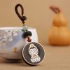Ebony Wood Avalokitesvara Keychain with Om Mani Padme Hum Ebony Wood Avalokitesvara Keychain with Om Mani Padme Hum