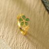 Anillo de Prosperidad en Jade Hetian y Plata 925 con Flor Dorada Hetian Jade Prosperity Ring in 925 Silver with Gold Flower