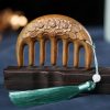 Green Sandalwood Plum Blossom Koi Fish Engraved Comb Green Sandalwood Plum Blossom Koi Fish Engraved Comb