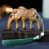 Green Sandalwood Plum Blossom Koi Fish Engraved Comb Green Sandalwood Plum Blossom Koi Fish Engraved Comb