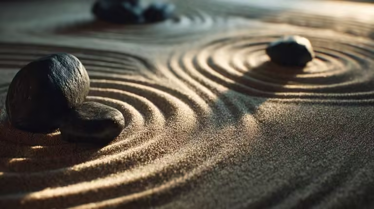 A serene meditation Zen garden with carefully raked sand and a few well-placed stones.