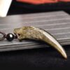 Natural Obsidian Wolf Tooth Strength Pendant Natural Obsidian Wolf Tooth Strength Pendant